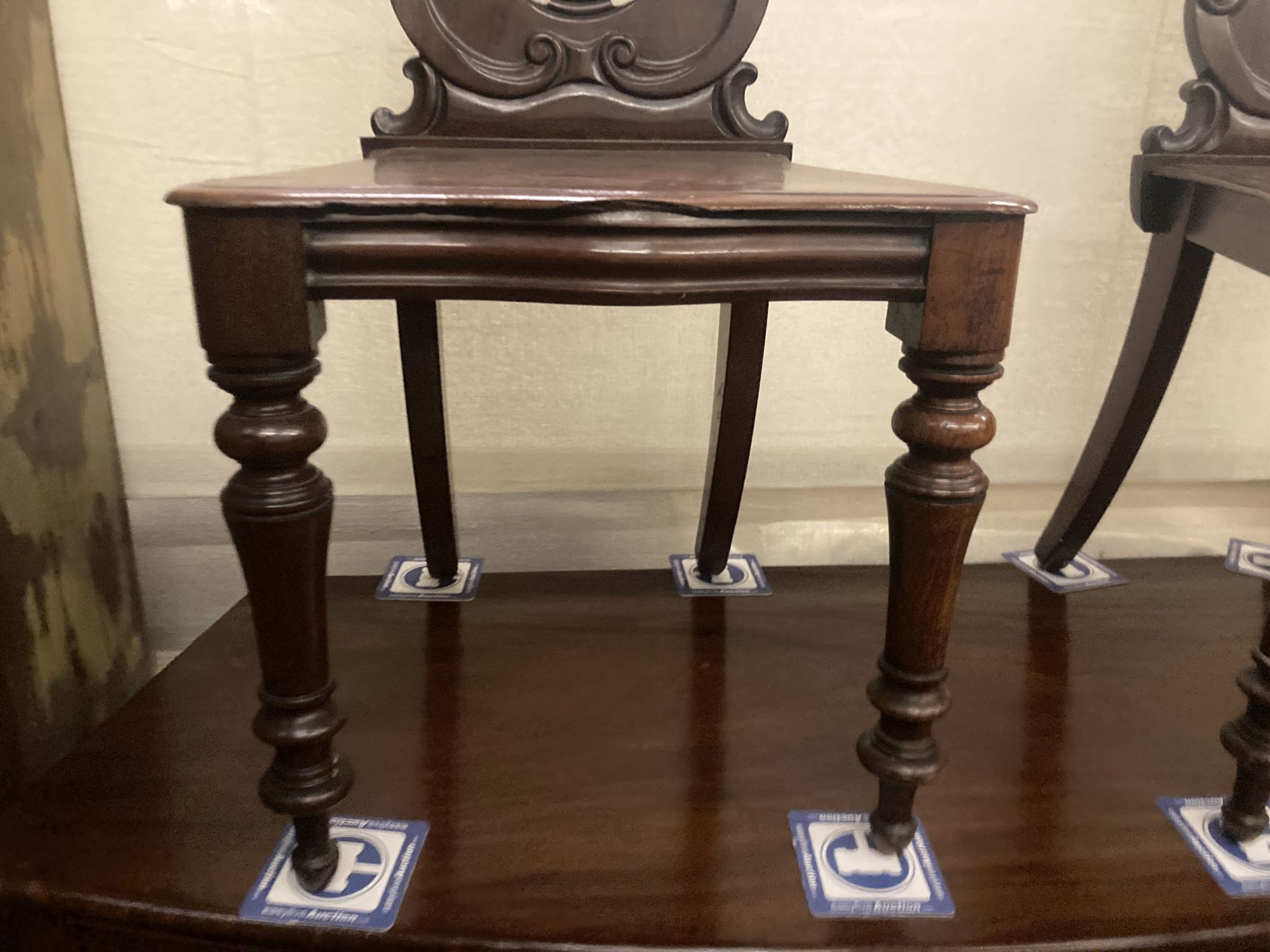 A pair of Victorian mahogany hall chairs